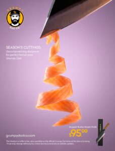 Grumpy Dad knife slicing spiral salmon gracefully.