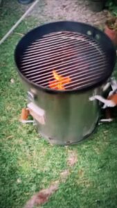 Outdoor barbecue grill with small fire