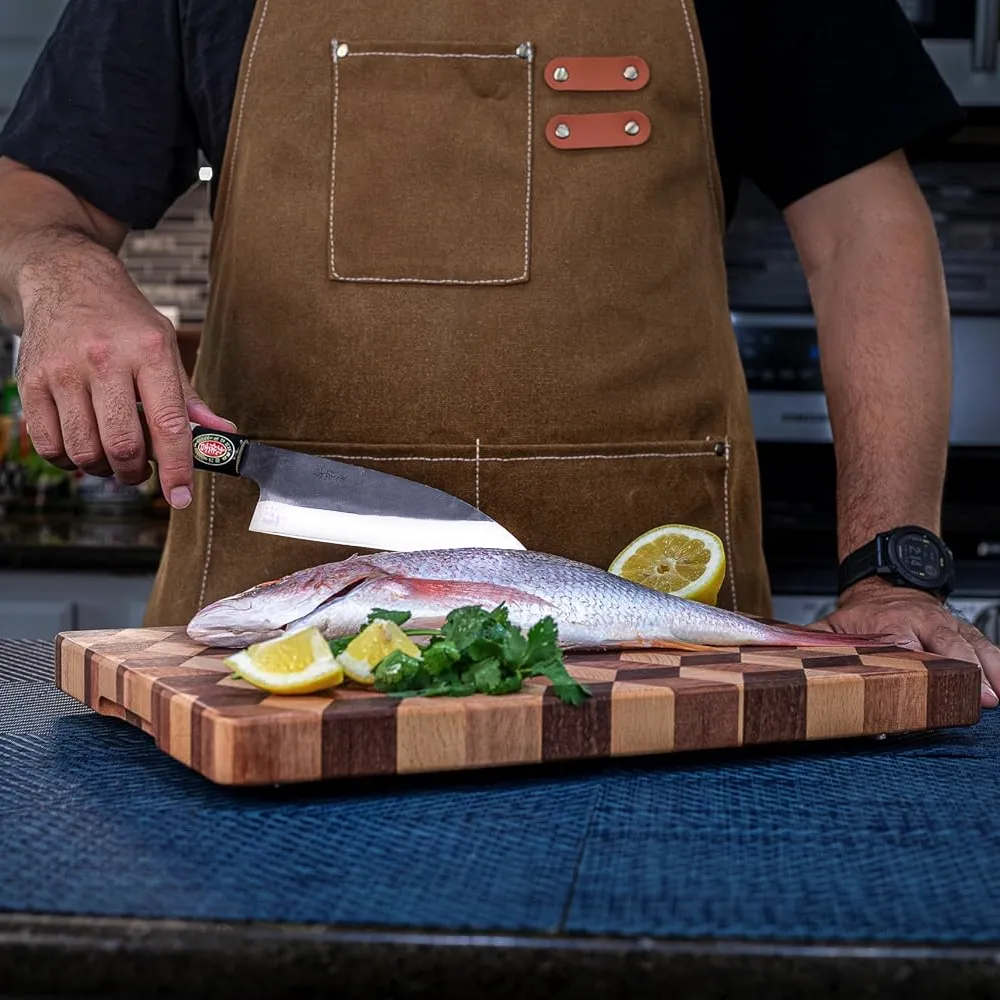 Person preparing fish with knife and lemon slices.