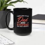 Black ceramic mug with the quote “I Have Two Titles: Dad and Stepdad” – ideal gift for blended families and Father’s Day.
