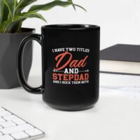 Black ceramic mug with the quote “I Have Two Titles: Dad and Stepdad” – ideal gift for blended families and Father’s Day.