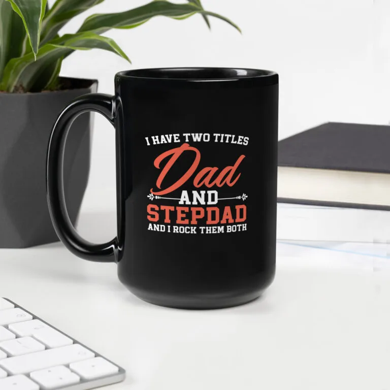 Black ceramic mug with the quote “I Have Two Titles: Dad and Stepdad” – ideal gift for blended families and Father’s Day.