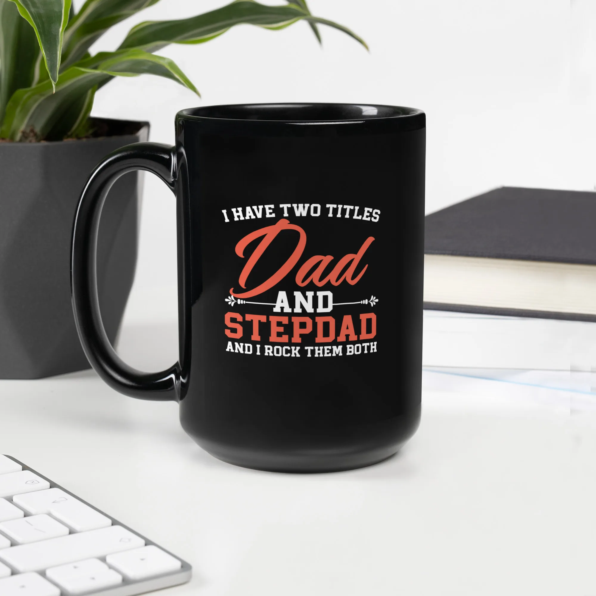 I Have Two Titles Dad and Stepdad – Black Mug Gift for Father’s Day and Stepdads Black ceramic mug with the quote “I Have Two Titles: Dad and Stepdad” – ideal gift for blended families and Father’s Day.