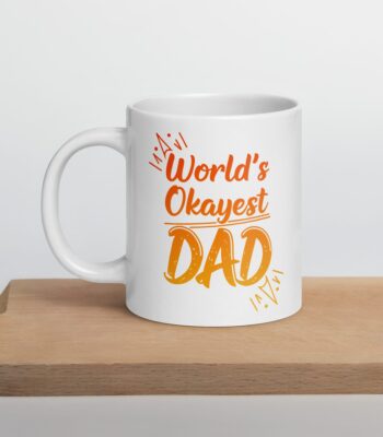White ceramic mug with the phrase “World’s Okayest Dad” in bold black text – a funny and relatable gift for dads.