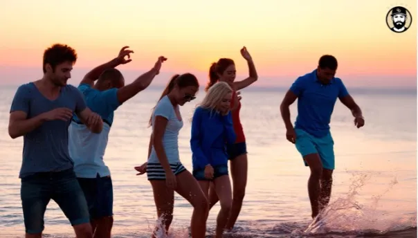 Friends enjoying sunset at the beach, splashing water.