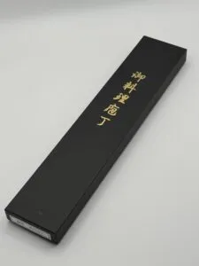 Black box with gold Japanese lettering
