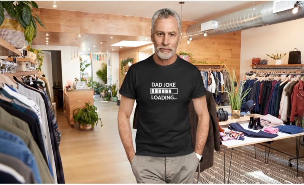 Man in store wearing 'Dad Joke Loading' shirt