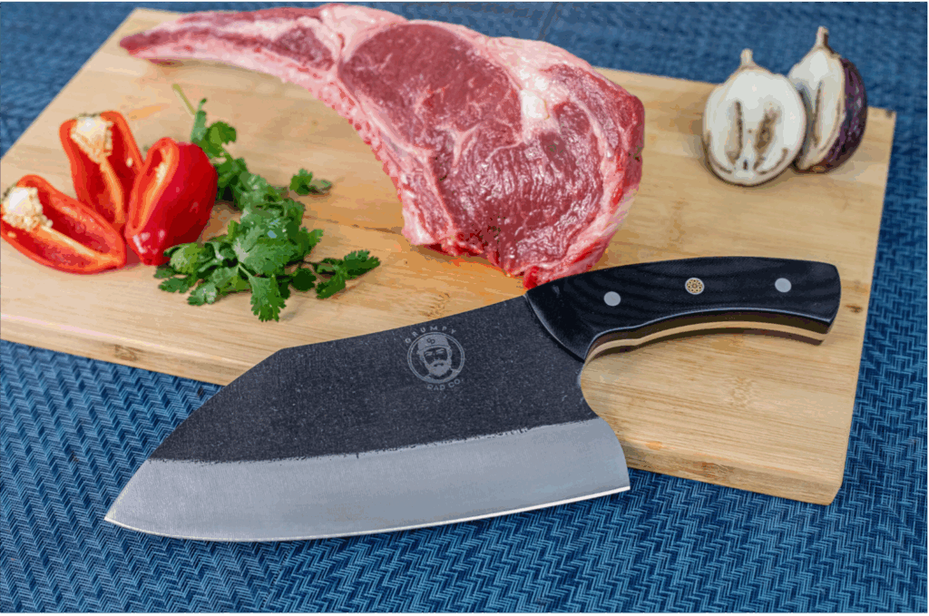 Steak and vegetables with a chef's knife