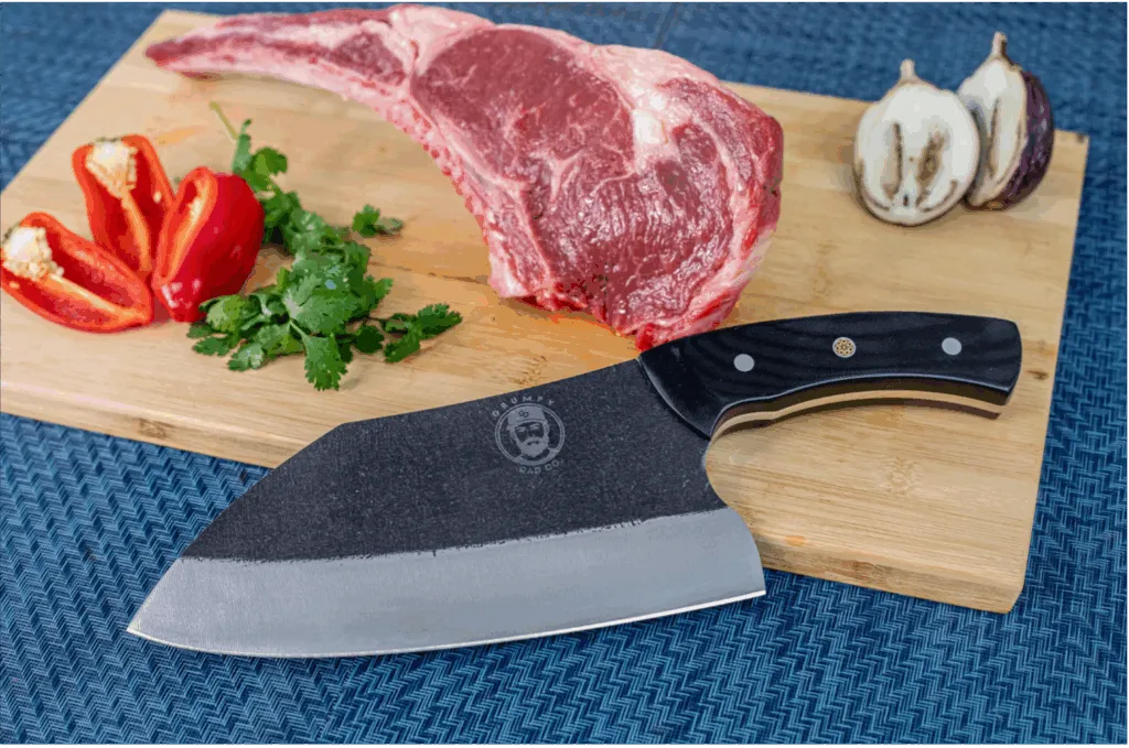 Steak and vegetables with a chef's knife