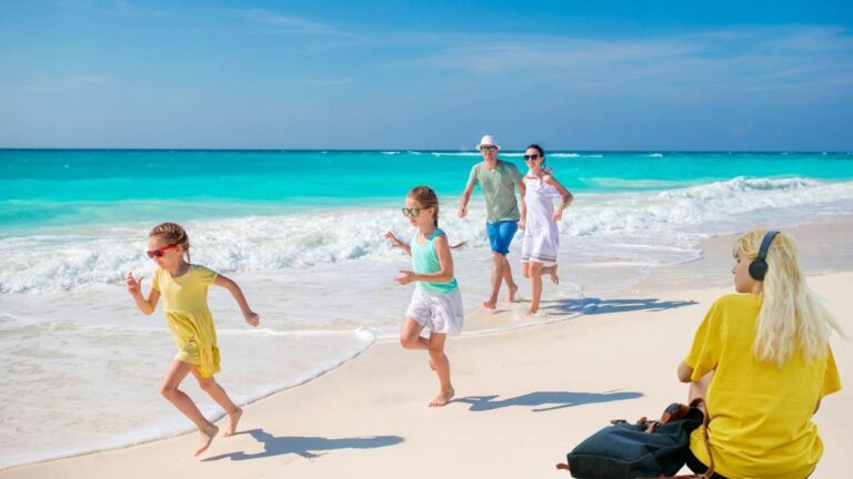 Family enjoying a sunny beach day together.