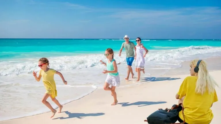 Family enjoying a sunny beach day together.