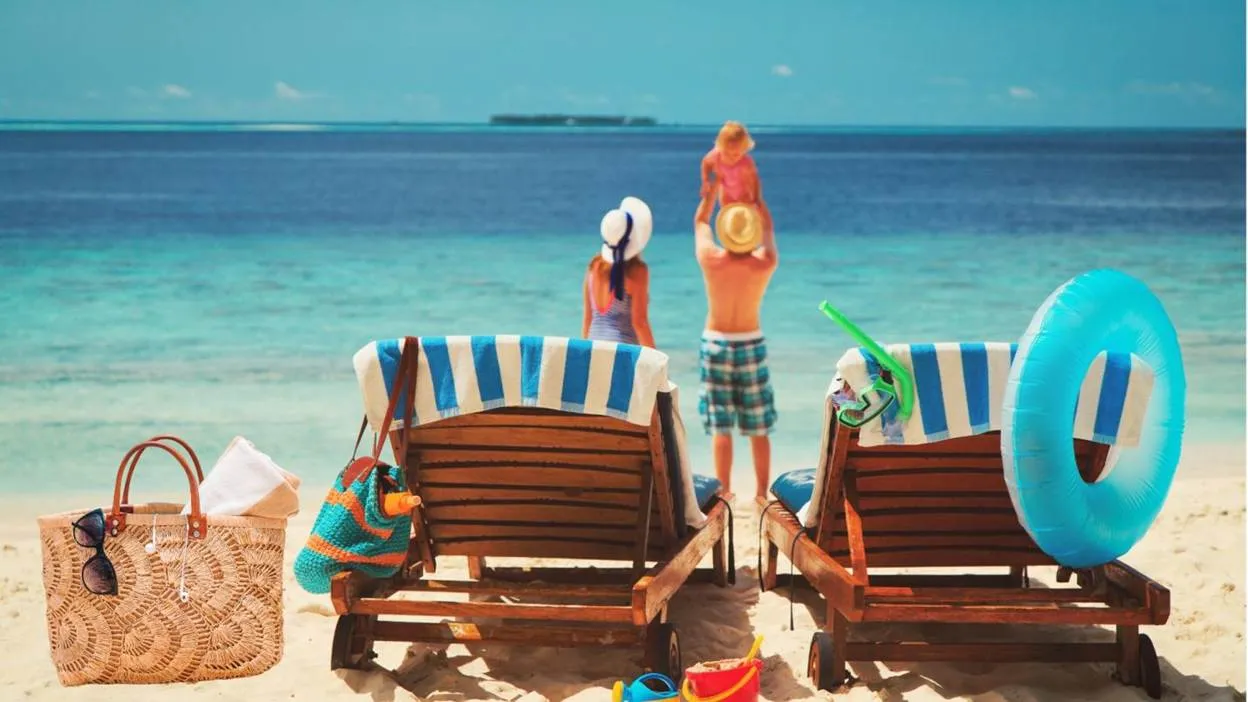 Family enjoying beach vacation with chairs and toys.