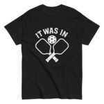 Black shirt with pickleball paddles and text design.