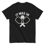 Black shirt with pickleball paddles and text design.