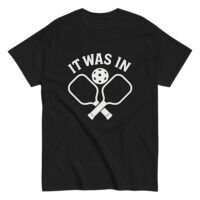 Black shirt with pickleball paddles and text design.
