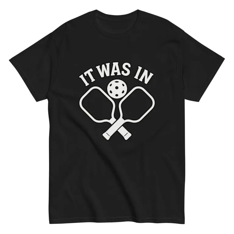 Black shirt with pickleball paddles and text design.