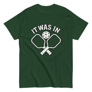 Green pickleball shirt with paddles and ball design.