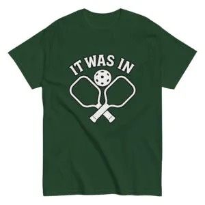 Green pickleball shirt with paddles and ball design.