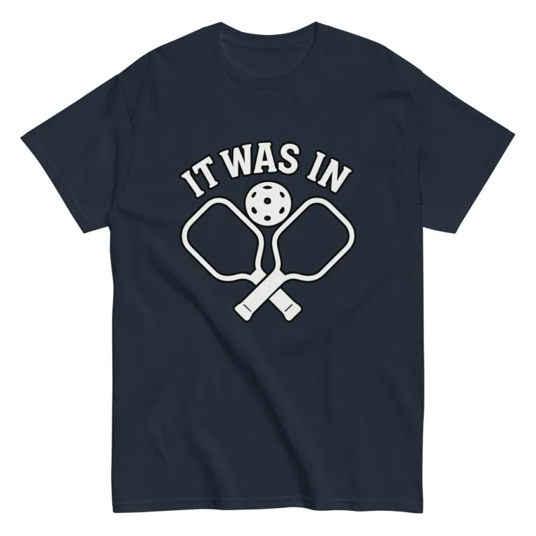Navy pickleball t-shirt with paddles, ball, text design.