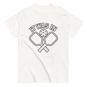 Pickleball shirt with paddles and ball design.