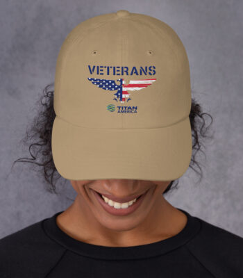 Person wearing Veterans cap with USA flag design.