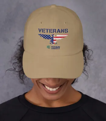Person wearing Veterans cap with USA flag design.