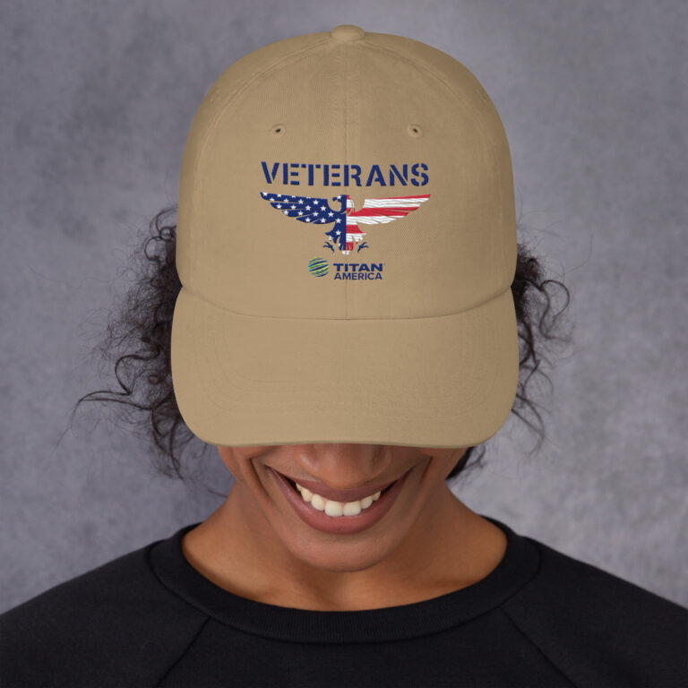 Person wearing Veterans cap with USA flag design.
