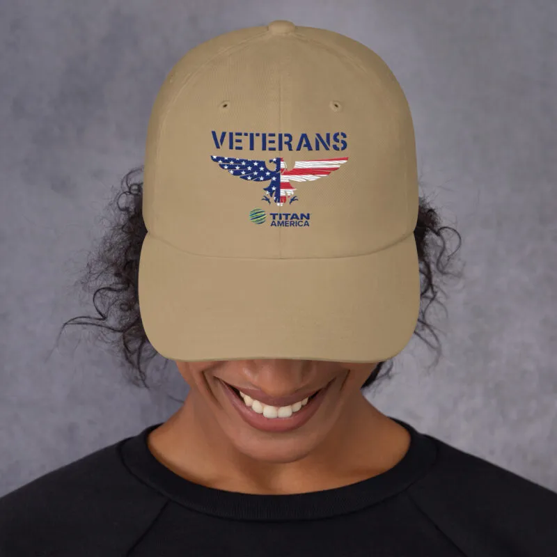 Person wearing Veterans cap with USA flag design.
