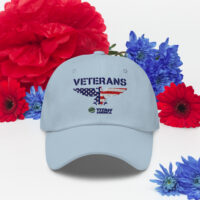 Veterans cap with red, blue flowers background.