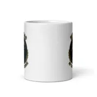 White mug with circular black design decal.