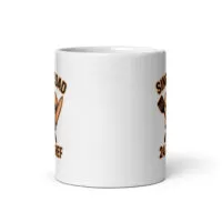 White mug with spatula design and text.