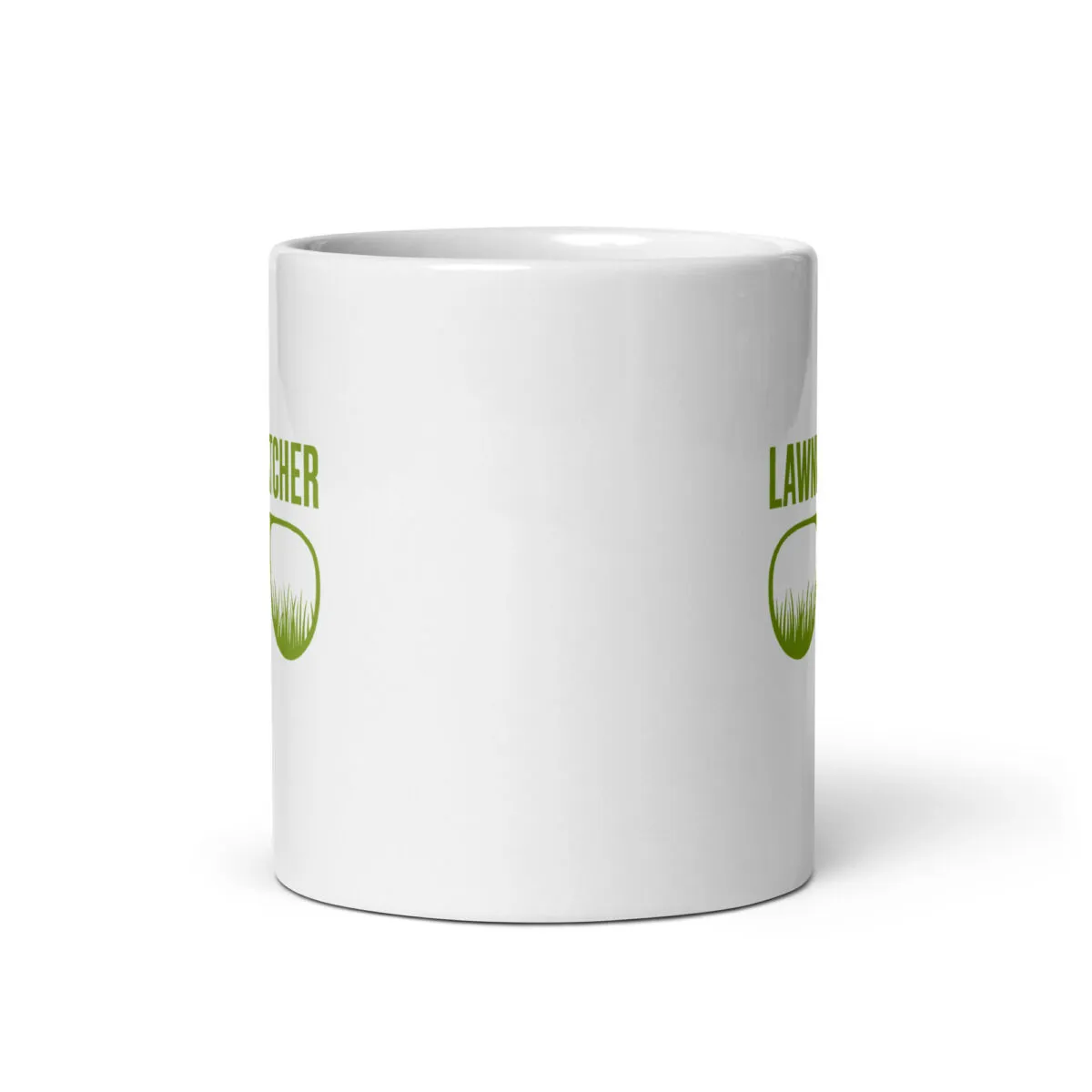 White mug with green text and grass logo.