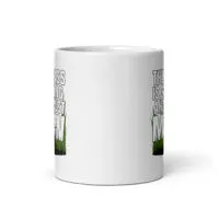 White mug with grass-themed text design.