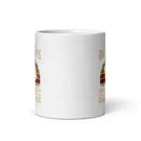 White mug with vintage design, partially visible text.