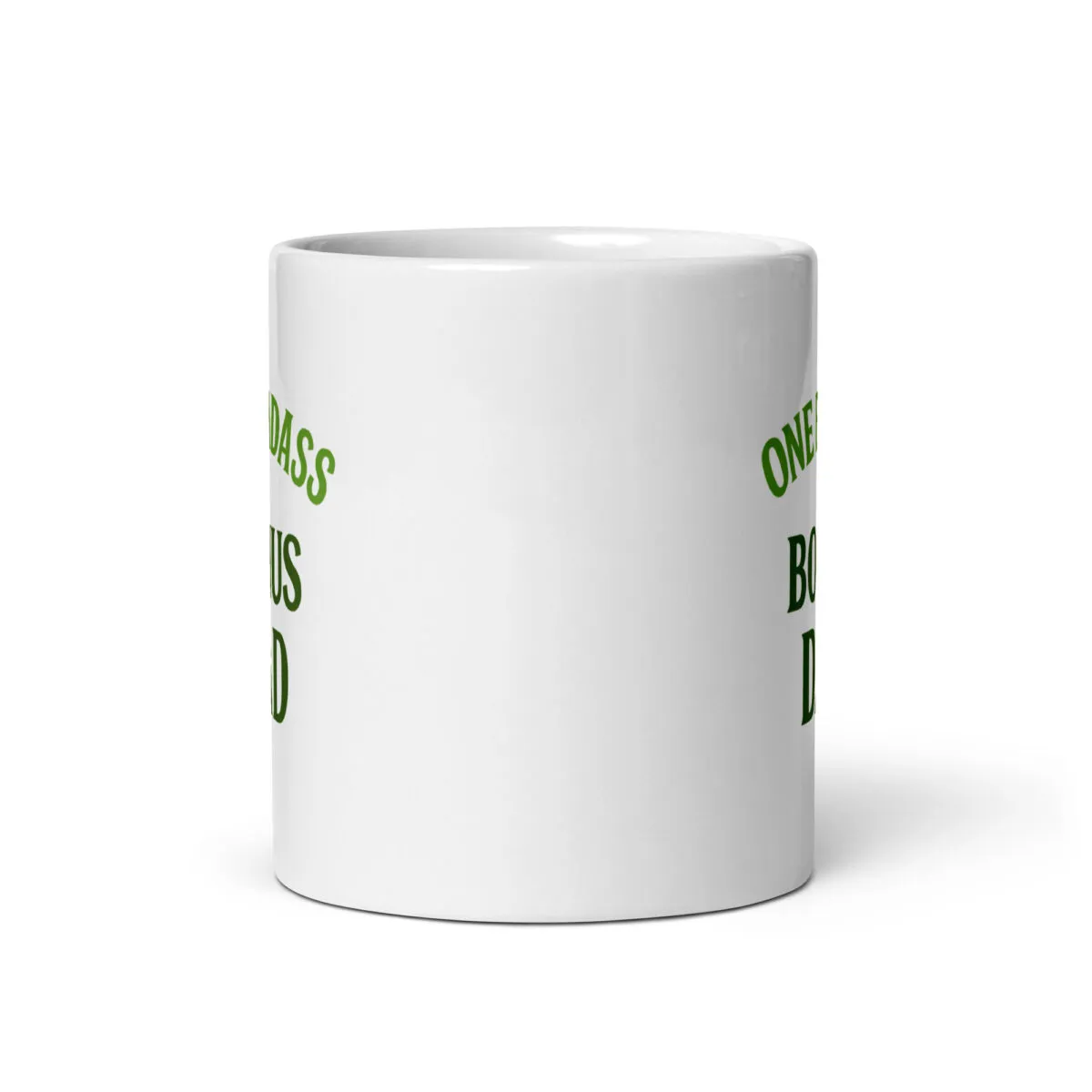 White mug with green text, partial view.