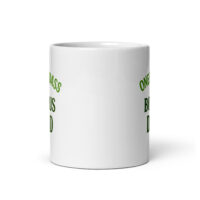White mug with green text, partial view.