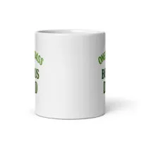 White mug with green text, partial view.