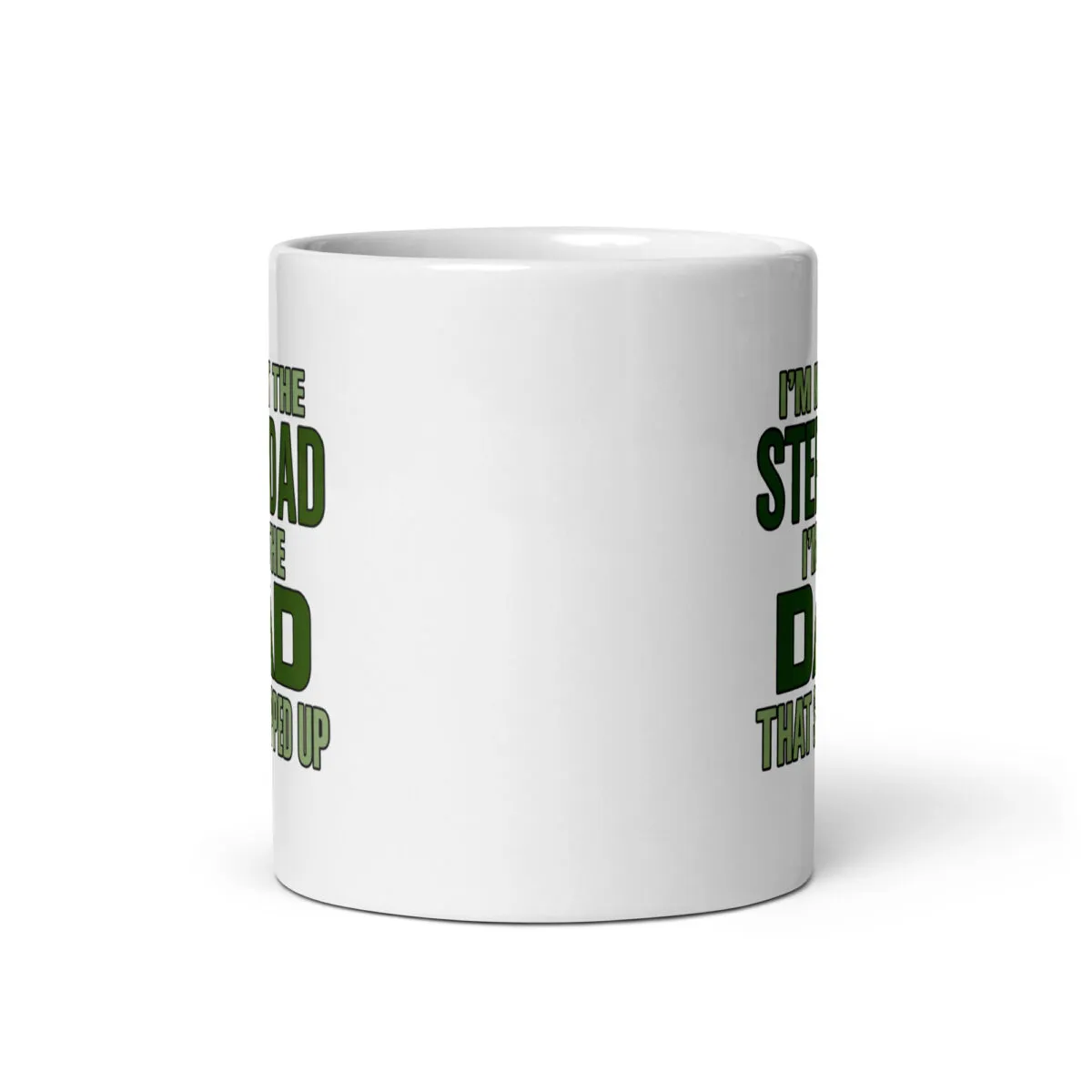 White mug with green text about stepdad.