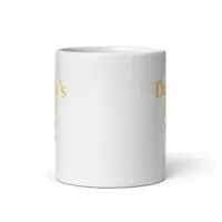 White ceramic mug with partial gold text