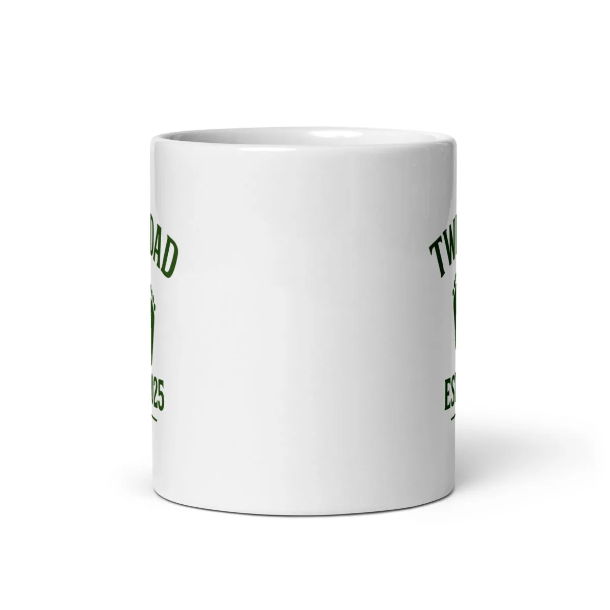 White mug with green text and design