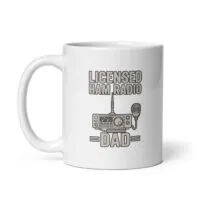 White mug with 'Licensed Ham Radio Dad' design.