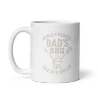 White mug with BBQ-themed design and text.