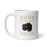White mug with camera and dad joke print.