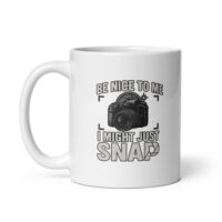 White mug with camera-themed design and humor text.