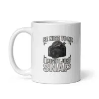 White mug with camera-themed design and humor text.