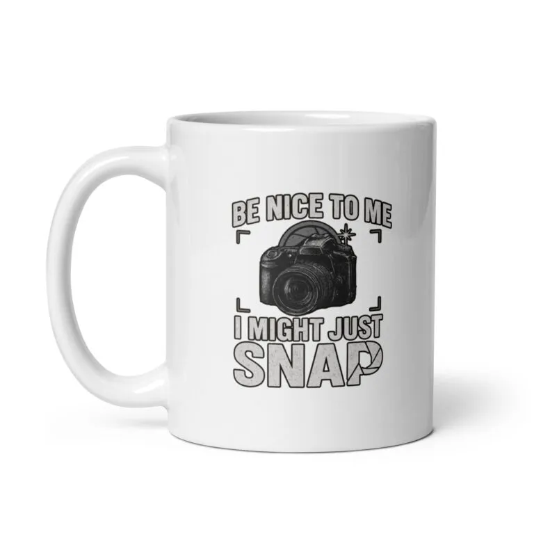 White mug with camera-themed design and humor text.
