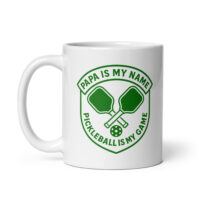 Pickleball mug with paddles and text design.