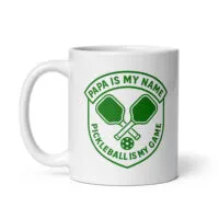 Pickleball mug with paddles and text design.
