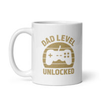 White mug with 'Dad Level Unlocked' design.