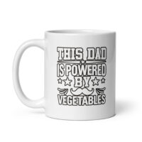 White mug with 'Powered by Vegetables' text.